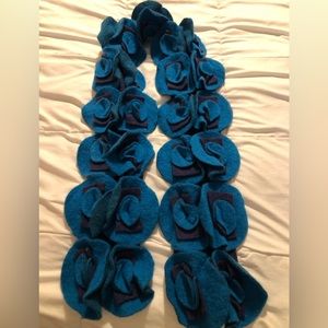 Wool blend flower appliquéd scarf made in Italy.